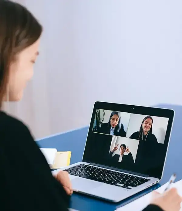 Person video conferencing on laptop-1